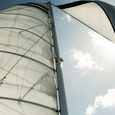 A close up of the sails of a sailboat.