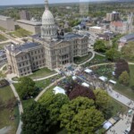 A view of the capitol building from the top of a tall building.